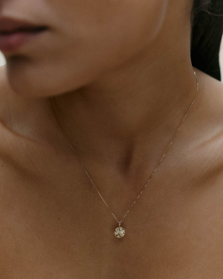 SACRED SUN CHARM (9K GOLD)