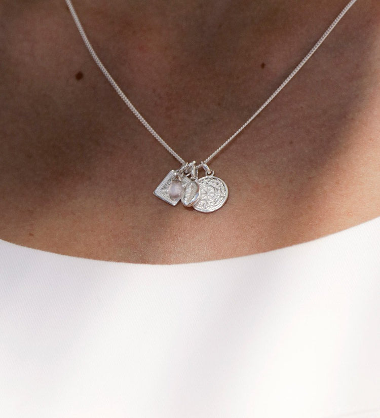 TINY TRUE NORTH COIN (STERLING SILVER)